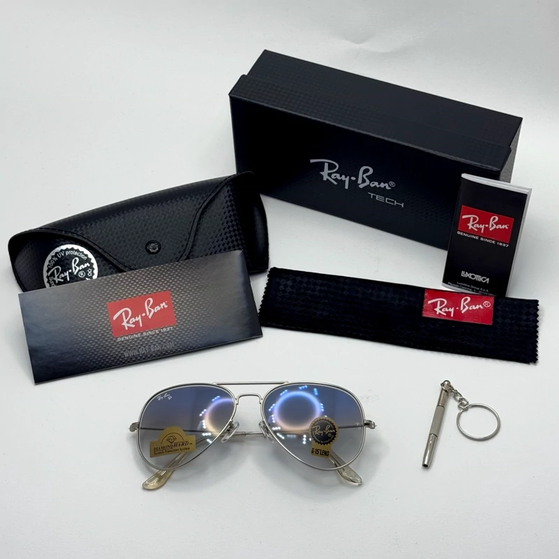 عینک ریبن خلبانی شیشه سنگ آبی هایلایت فریم نقره ای به همراه پک کامل ریبن کد Rayban RB 3025